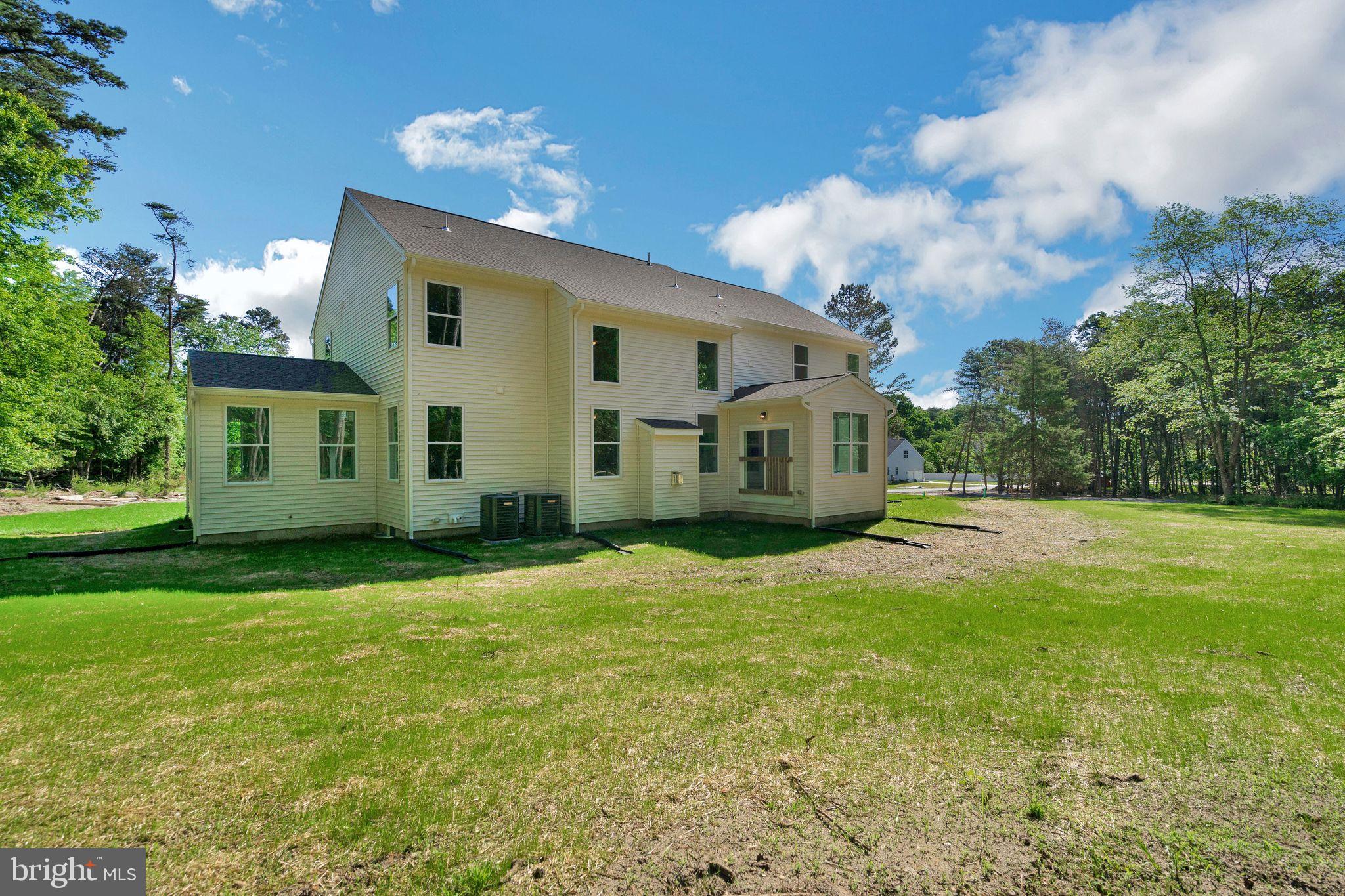 848 Saw Mill Road, Unit D Townsend, DE 19734 - Photo 6 of 53 a house view with a garden space