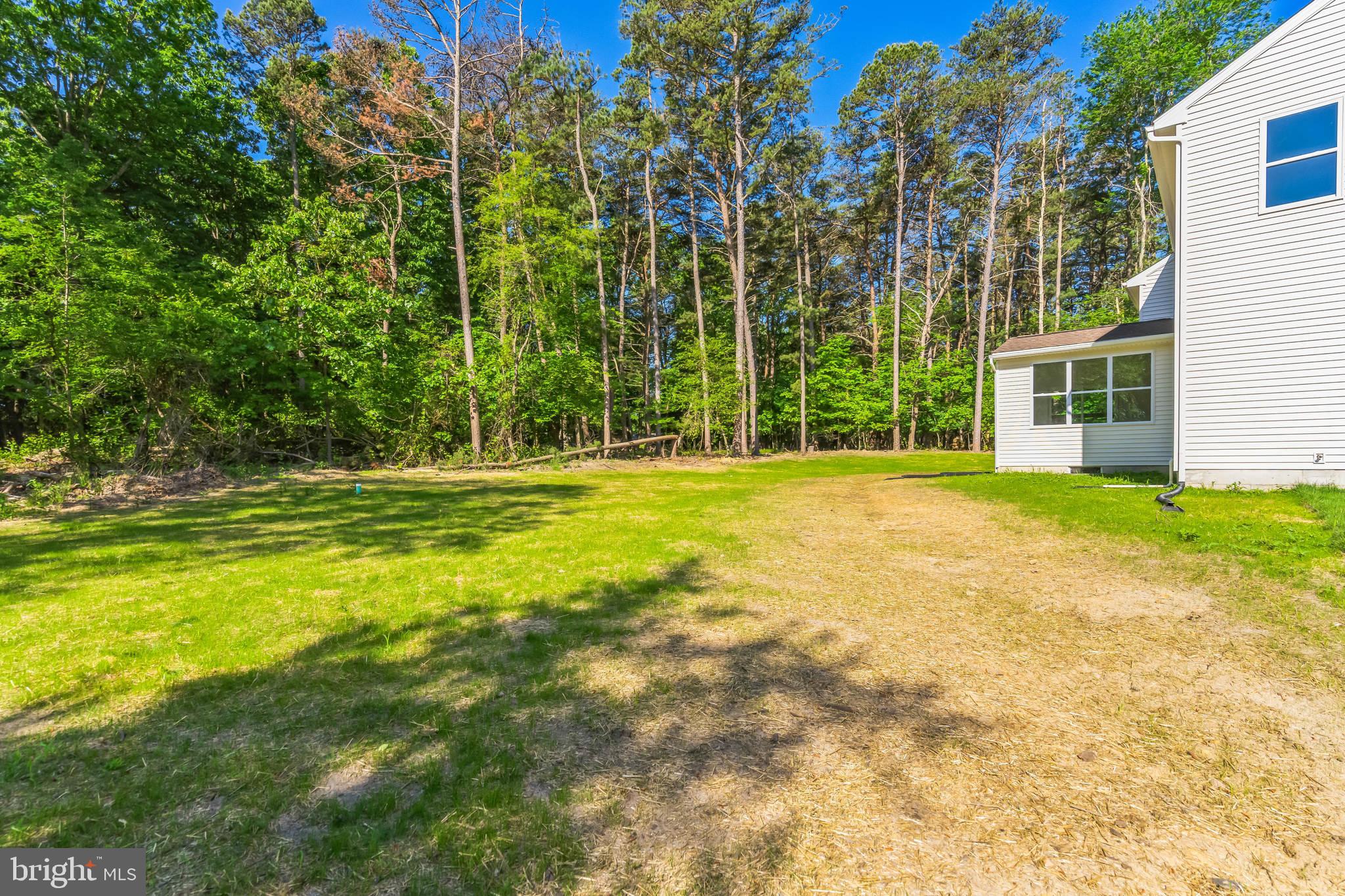 848 Saw Mill Road, Unit D Townsend, DE 19734 - Photo 8 of 53 a swimming pool with outdoor seating and yard