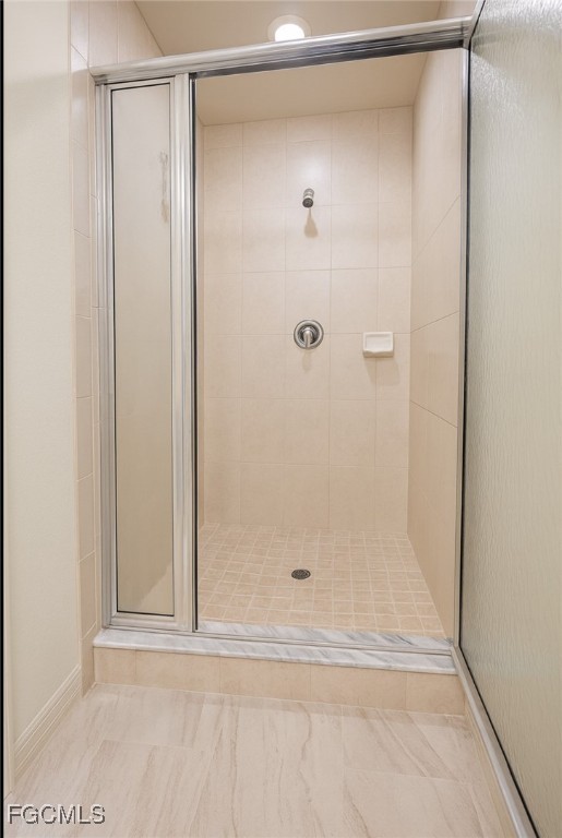 3304 Skyline Boulevard, Unit 202 Cape Coral, FL 33914 - Photo 14 of 20 a bathroom with a glass shower door