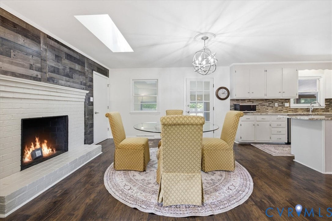 404 Bermuda Hundred Road Chester, VA 23836 - Photo 8 of 37 Living area with a white brick fireplace and wood-