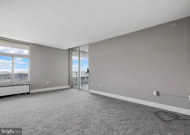 a view of an empty room with a window