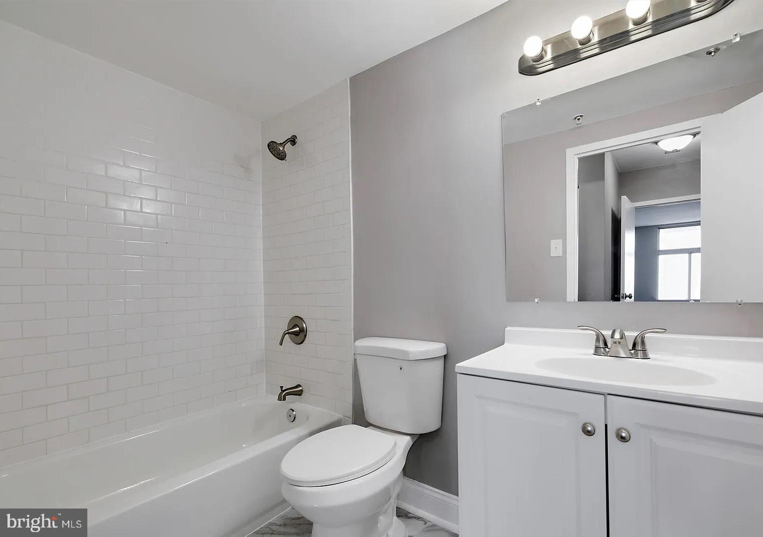28 Allegheny Avenue, Unit 2502 Towson, MD 21204 - Photo 16 of 22 a bathroom with a sink toilet vanity and shower