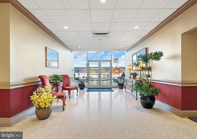 a room with gym equipment and large window