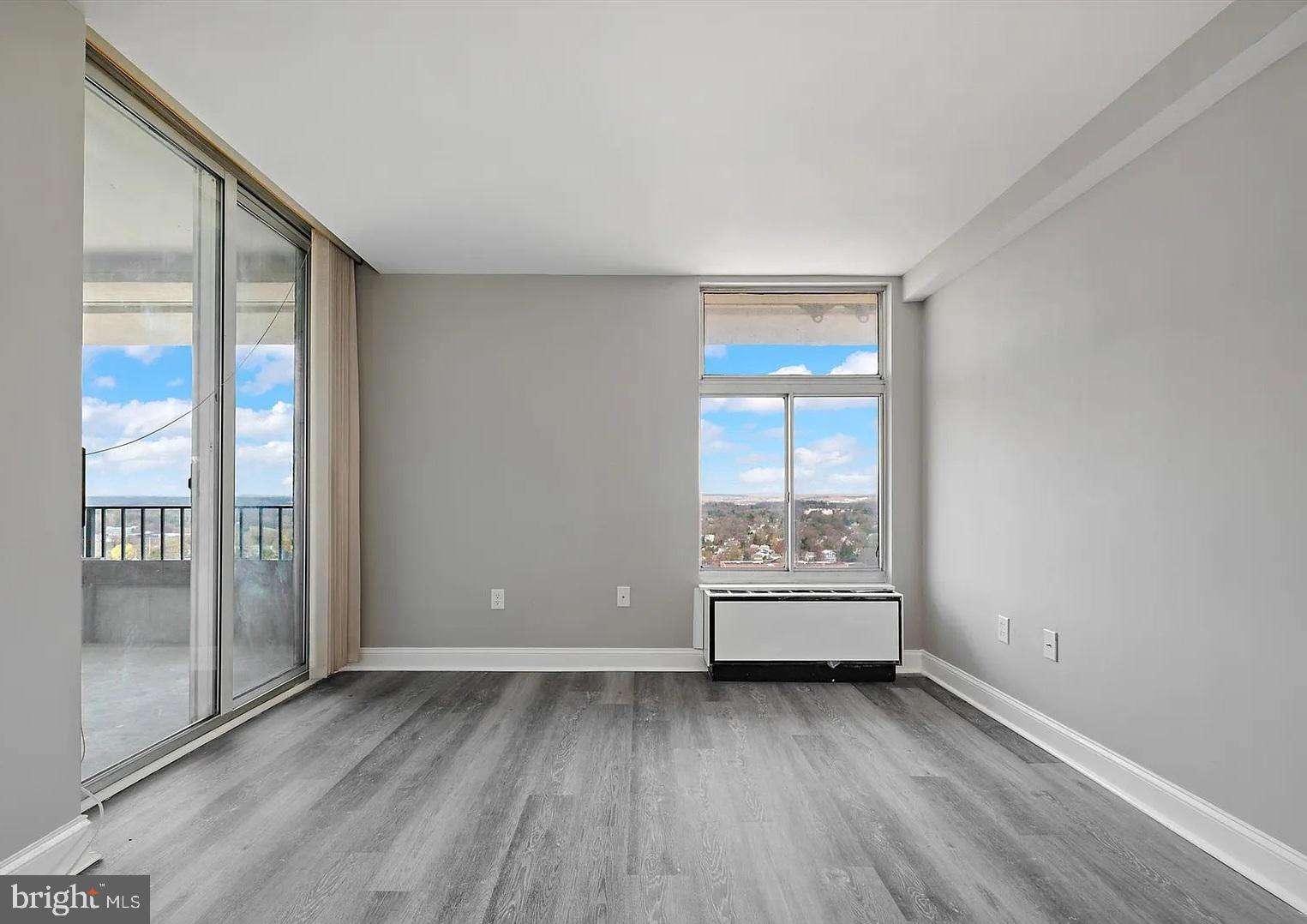 28 Allegheny Avenue, Unit 2502 Towson, MD 21204 - Photo 9 of 22 wooden floor in an empty room with a window