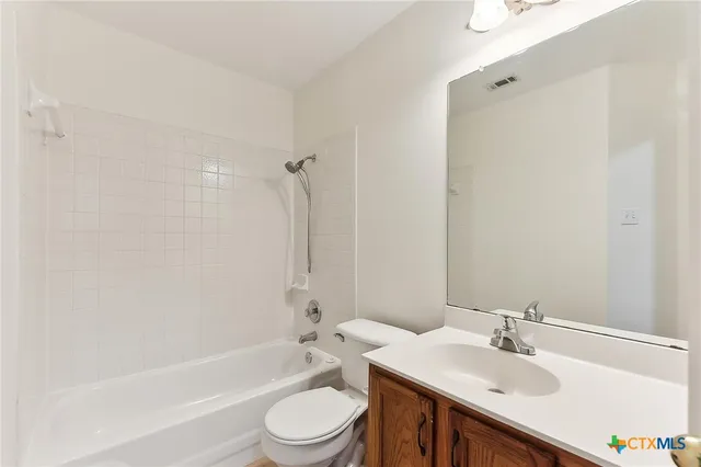 a bathroom with a sink toilet and a bathtub