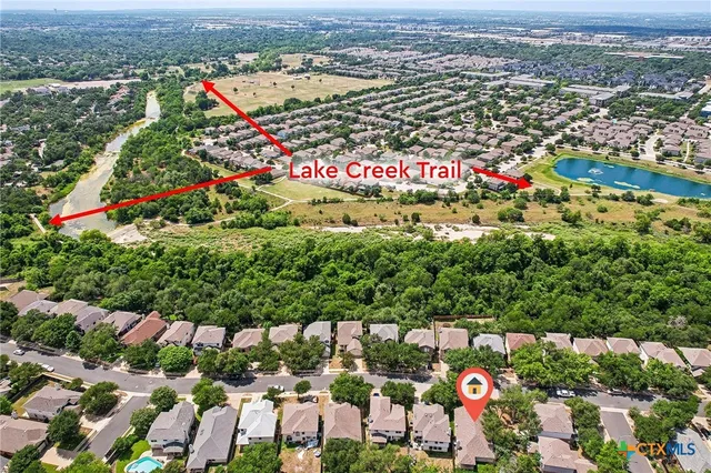 a view of a park that has large trees