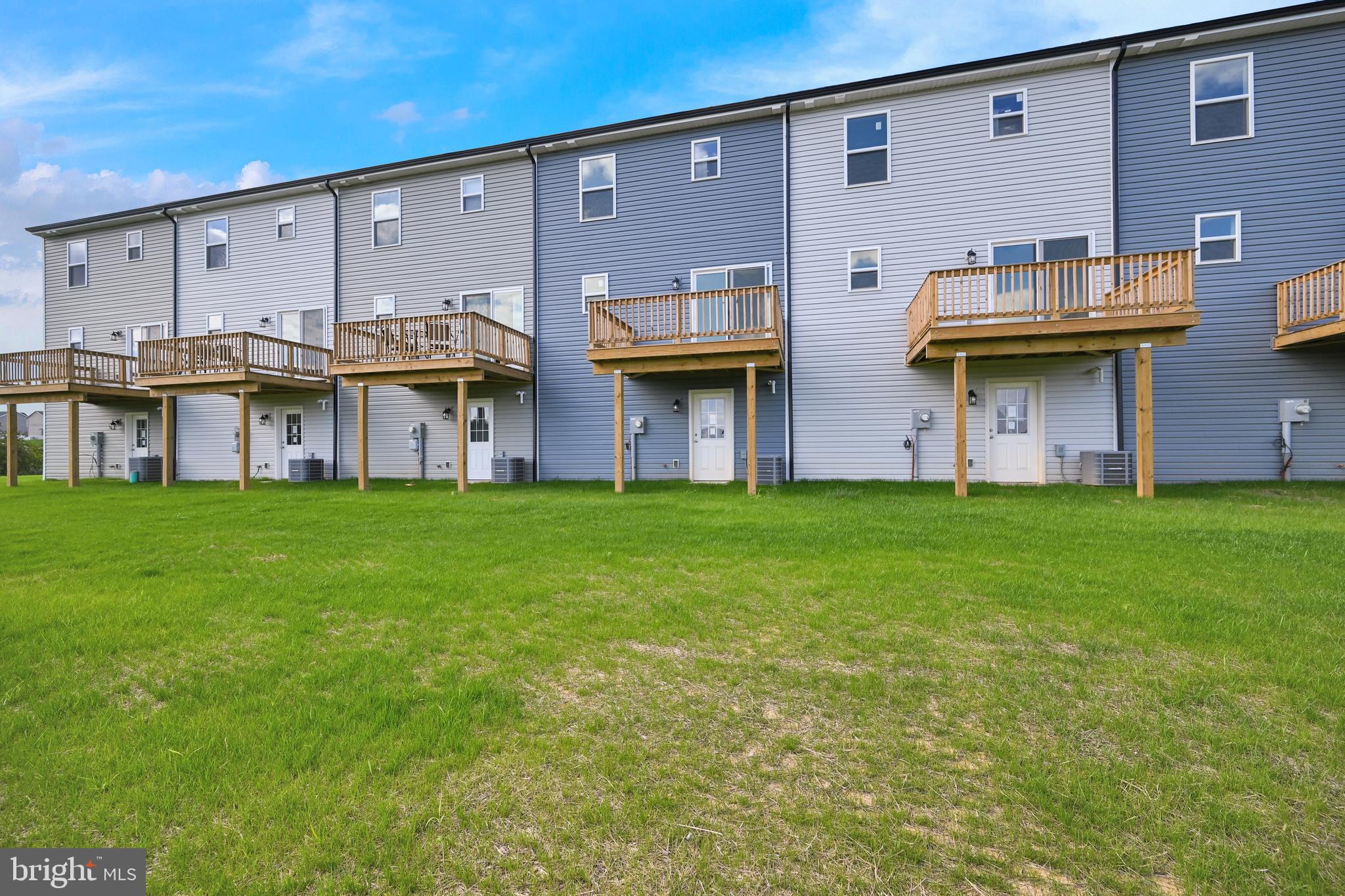 20 Landing Place, Unit 20 York, PA 17408 - Photo 26 of 27 a view of a building with a garden and plants