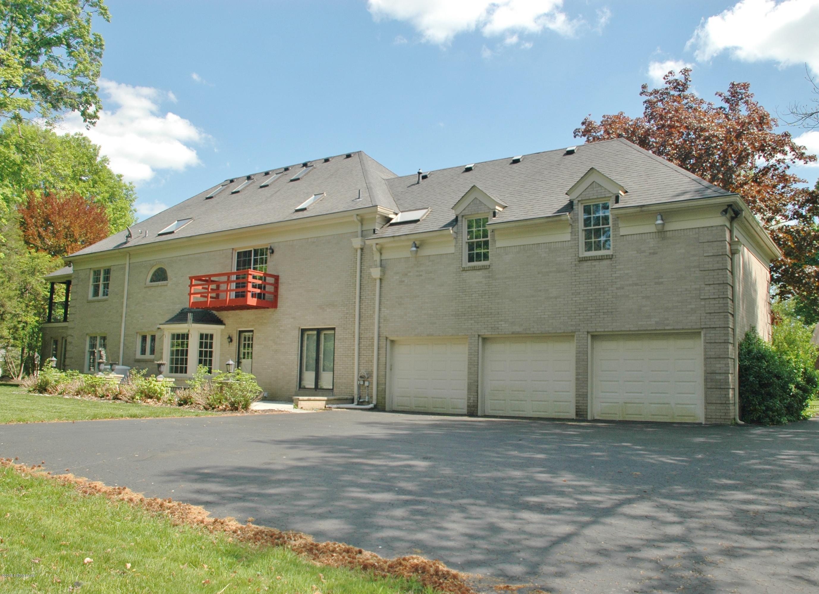 813 Rugby Place Louisville, KY 40222 - Photo 5 of 54 Rear view of home with attached three car garage.