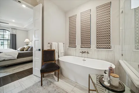 a spacious bathroom with a bathtub and a couch