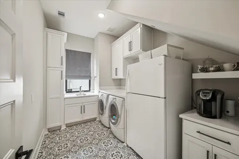 a white refrigerator freezer sitting in a kitchen