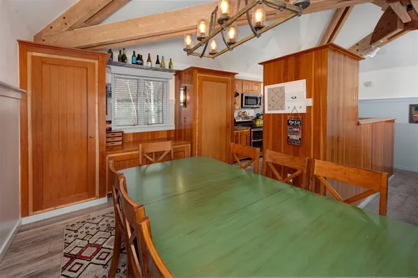 a dining room with furniture and window