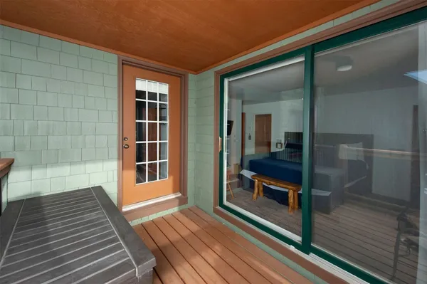 a room with a window and a cabinet