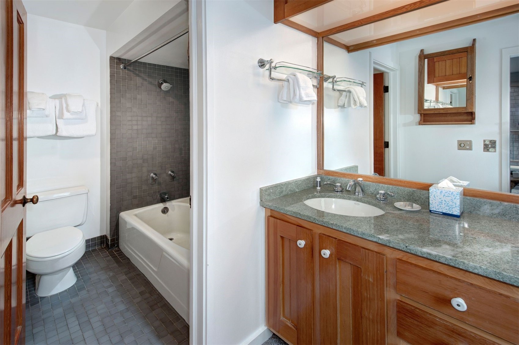 352 Wild Irishman Road, Unit 1907 Keystone, CO 80435 - Photo 26 of 43 a bathroom with a granite countertop sink a toilet and shower