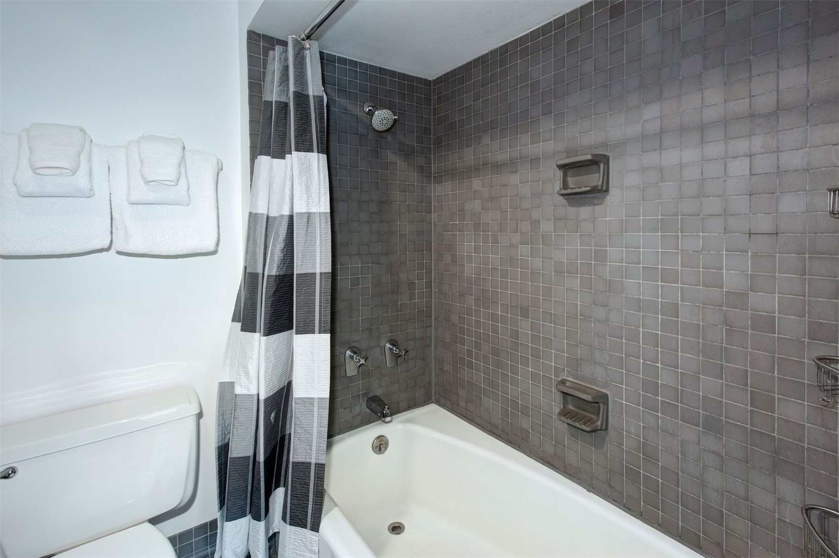 352 Wild Irishman Road, Unit 1907 Keystone, CO 80435 - Photo 27 of 43 a bathroom with a bathtub and a shower