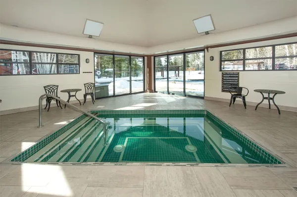 a view of a swimming pool with a patio