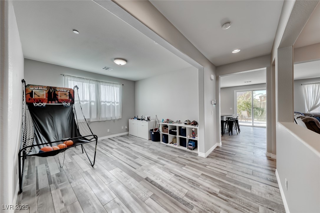723 Gorringe Ridge Court Henderson, NV 89002 - Photo 18 of 48 Rec room featuring plenty of natural light, light wood-type flooring, and recessed lighting
