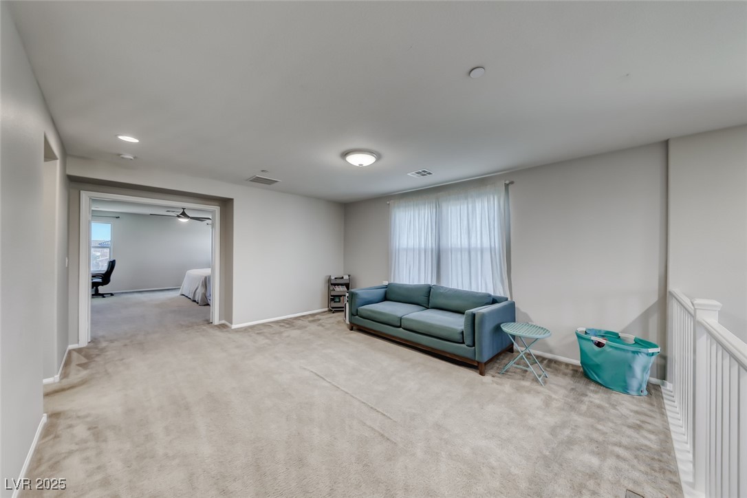 723 Gorringe Ridge Court Henderson, NV 89002 - Photo 21 of 48 Sitting room with carpet, recessed lighting, and ceiling fan