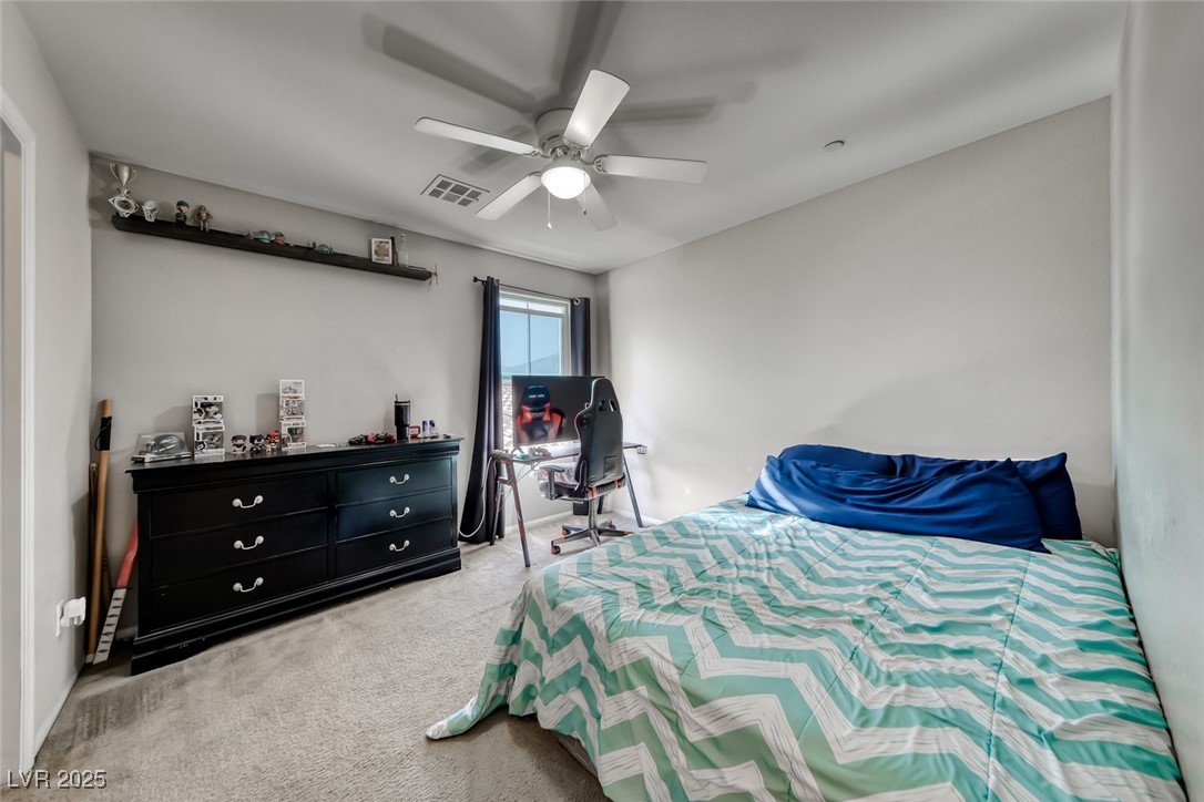 723 Gorringe Ridge Court Henderson, NV 89002 - Photo 28 of 48 Carpeted bedroom with ceiling fan