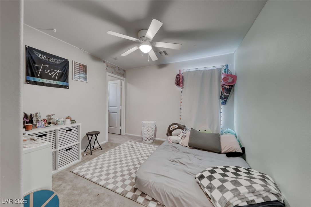 723 Gorringe Ridge Court Henderson, NV 89002 - Photo 29 of 48 Bedroom with light carpet and a ceiling fan