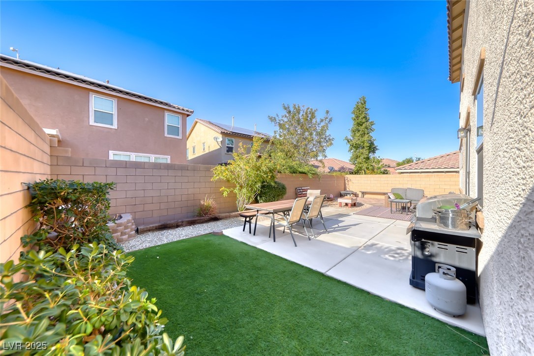 723 Gorringe Ridge Court Henderson, NV 89002 - Photo 36 of 48 Fenced backyard featuring a patio area and grilling area