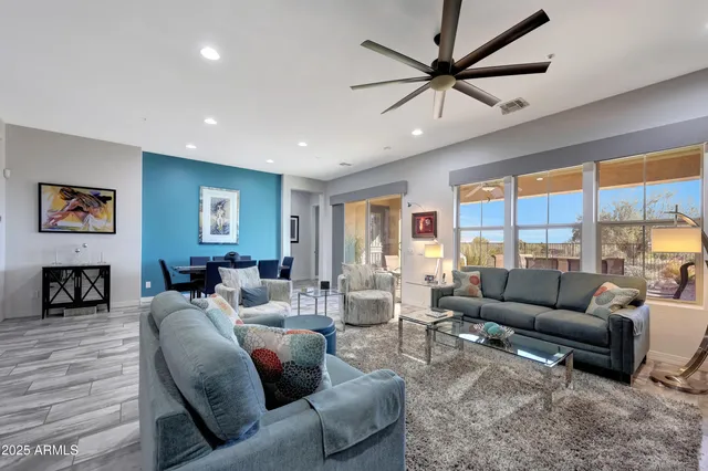 a large kitchen with a table and chairs