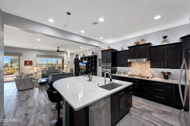 a kitchen with a table and chairs in it