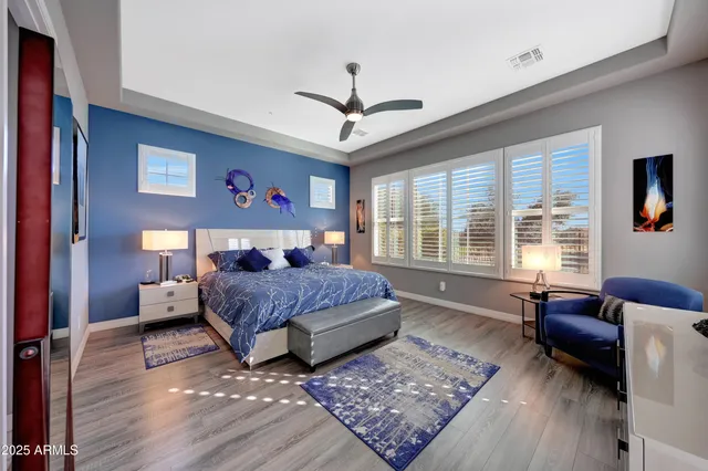 a bathroom with a double vanity sink a mirror and a shower