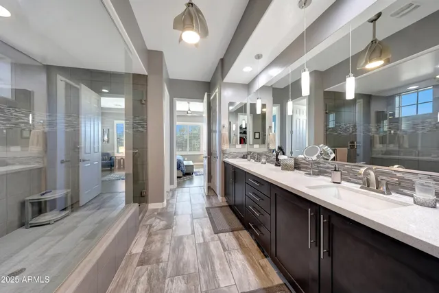 a living room with furniture a couch and a window