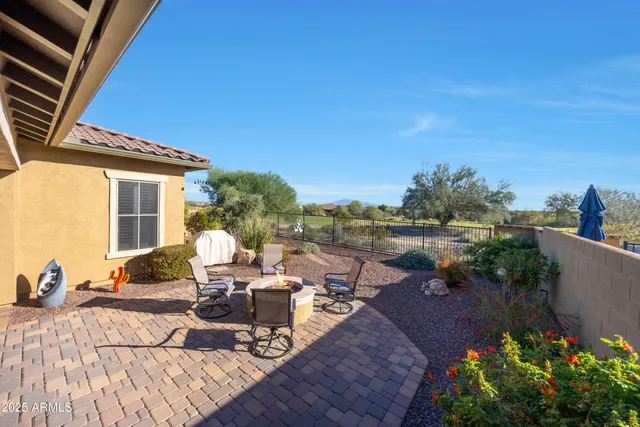 an aerial view of house with yard and lake view