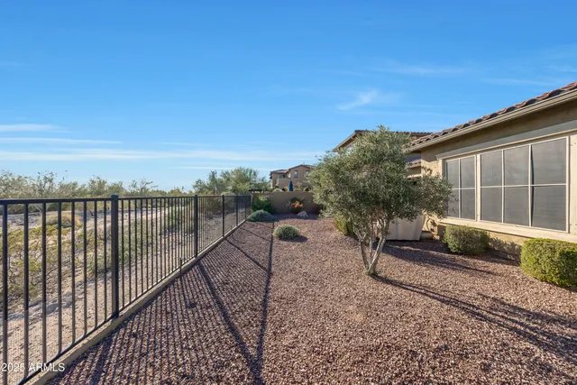 an aerial view of house with yard swimming pool and outdoor seating