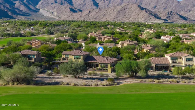 a living room with stainless steel appliances kitchen island granite countertop furniture a rug and a kitchen view