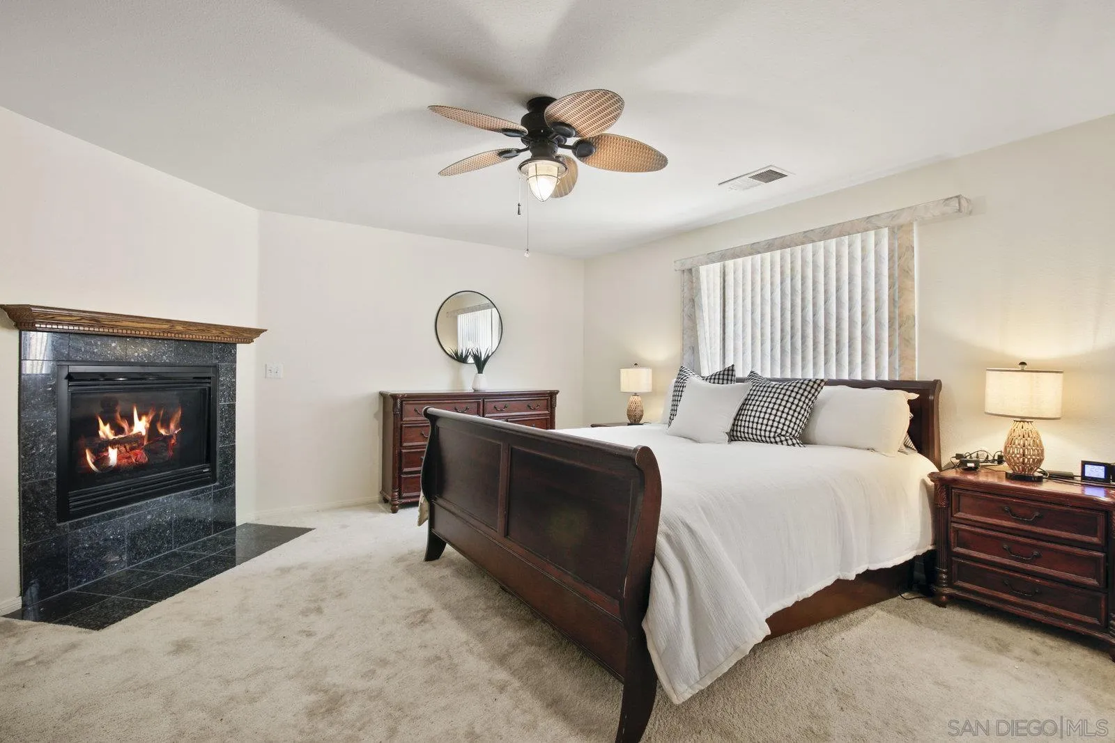 10442 Nate Way Santee, CA 92071 - Photo 15 of 31 a bedroom with a bed and a fireplace