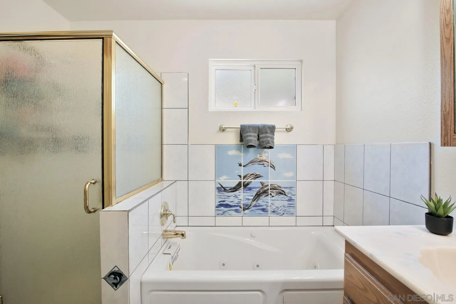 10442 Nate Way Santee, CA 92071 - Photo 17 of 31 a bathroom with a bathtub and shower