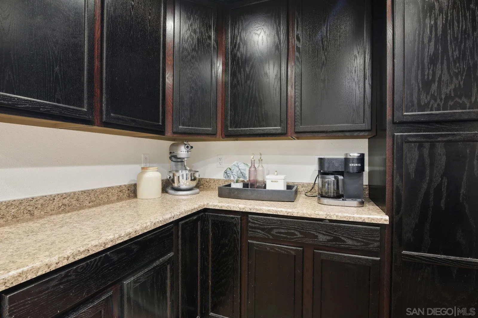10442 Nate Way Santee, CA 92071 - Photo 6 of 31 a kitchen with a sink and a wooden cabinets