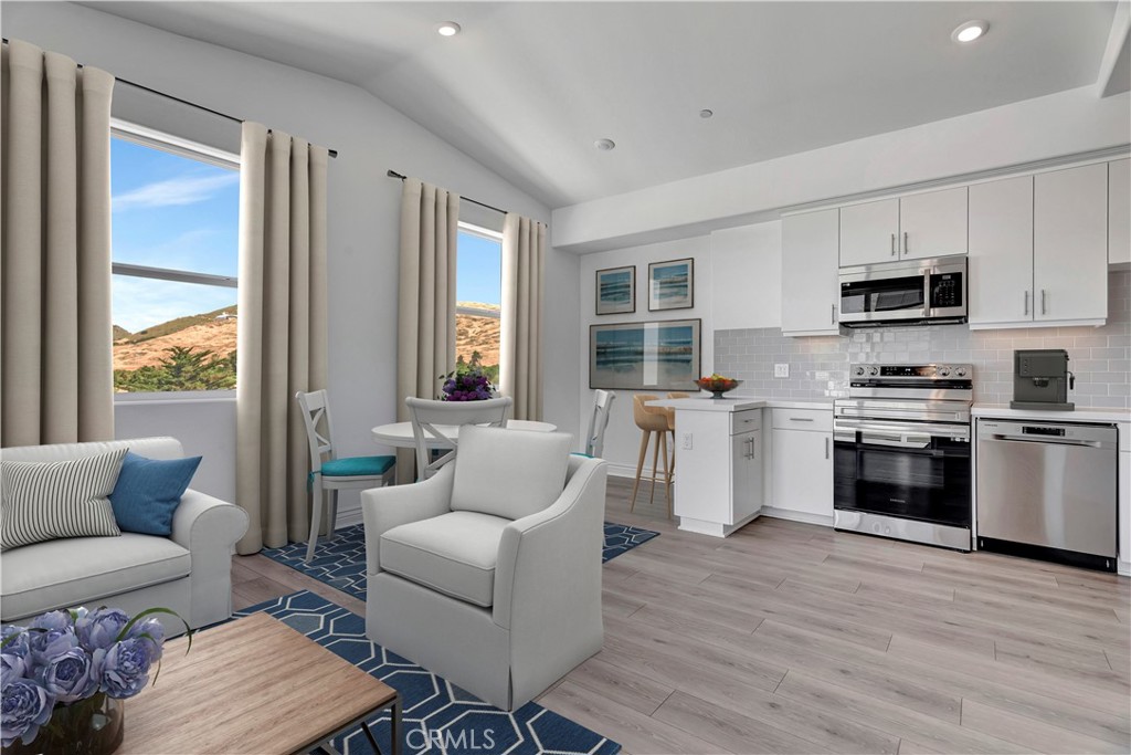 815 Madonna Road, Unit 301 San Luis Obispo, CA 93405 - Photo 1 of 1 a living room with furniture and a kitchen