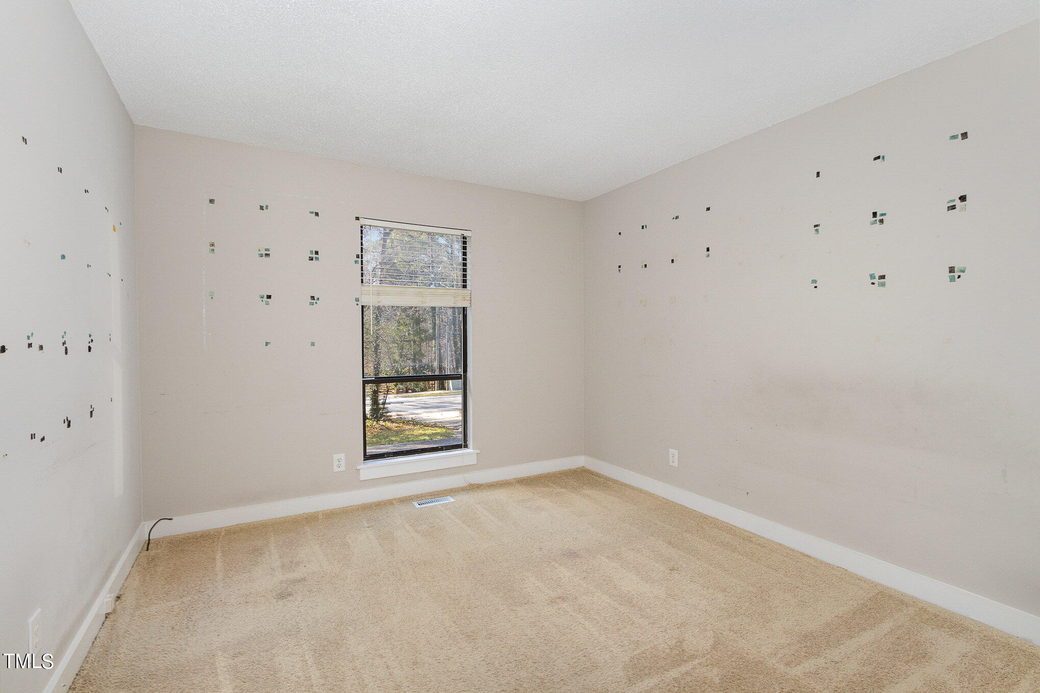 6309 Garrett Road Durham, NC 27707 - Photo 11 of 17 a view of an empty room with a window