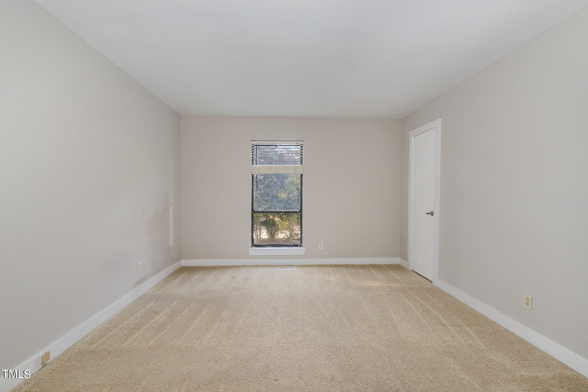 6309 Garrett Road Durham, NC 27707 - Photo 12 of 17 an empty room with a window