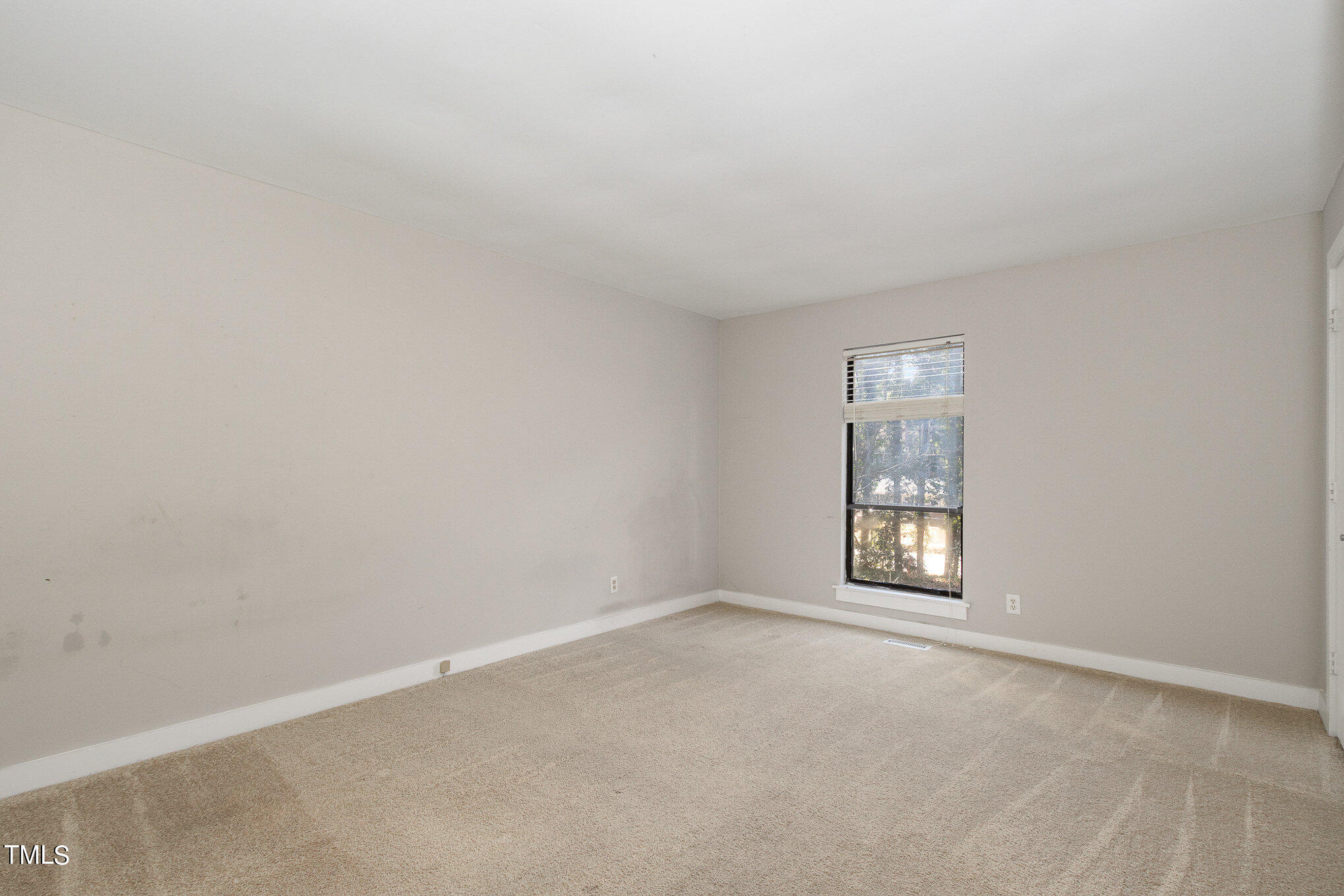 6309 Garrett Road Durham, NC 27707 - Photo 13 of 17 an empty room with windows