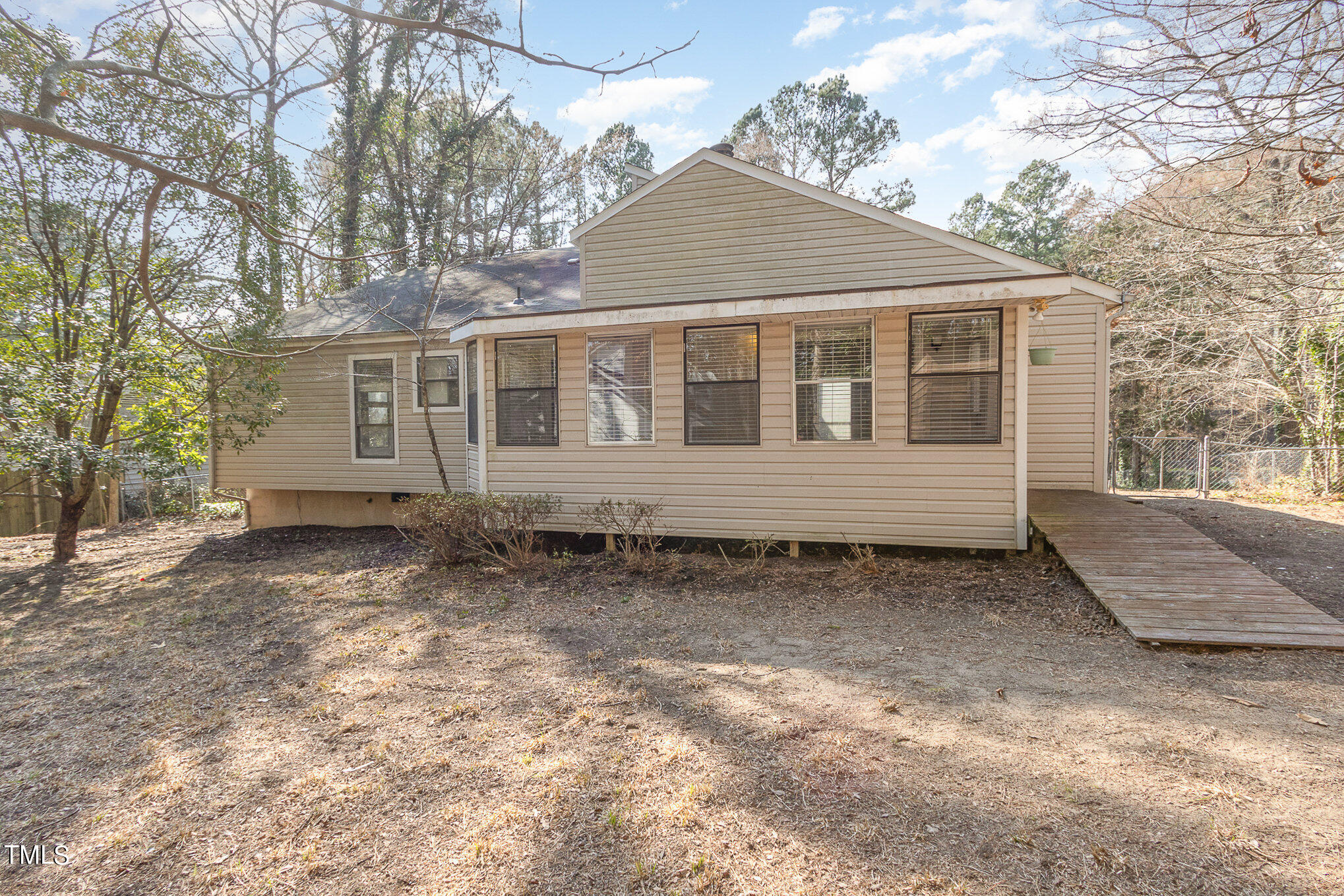 6309 Garrett Road Durham, NC 27707 - Photo 16 of 17 a house view with a backyard space