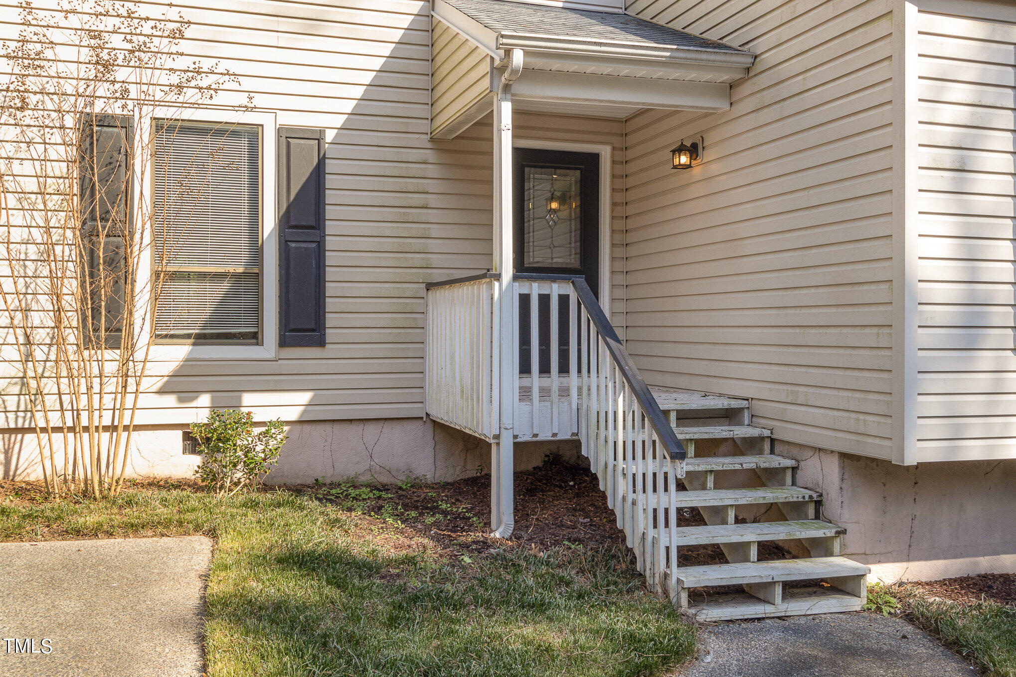 6309 Garrett Road Durham, NC 27707 - Photo 2 of 17 a view of a house with a yard and stairs