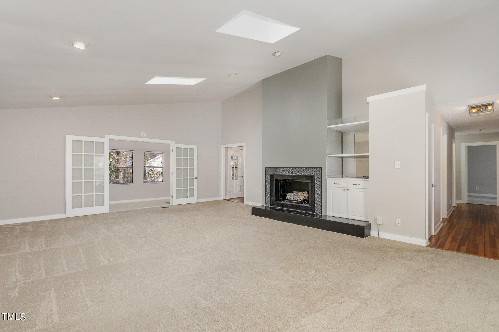 6309 Garrett Road Durham, NC 27707 - Photo 3 of 17 a view of an empty room with a fireplace