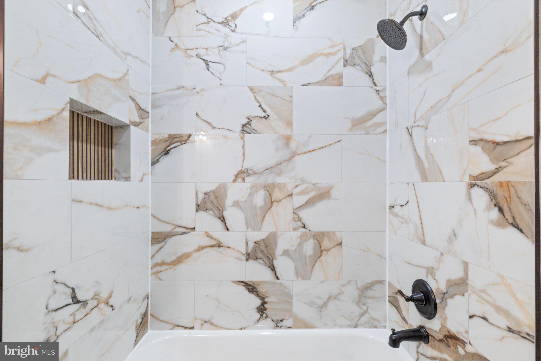 653 Bartlett Avenue Baltimore, MD 21218 - Photo 23 of 39 Gorgeous custom tile in upper level bathroom
