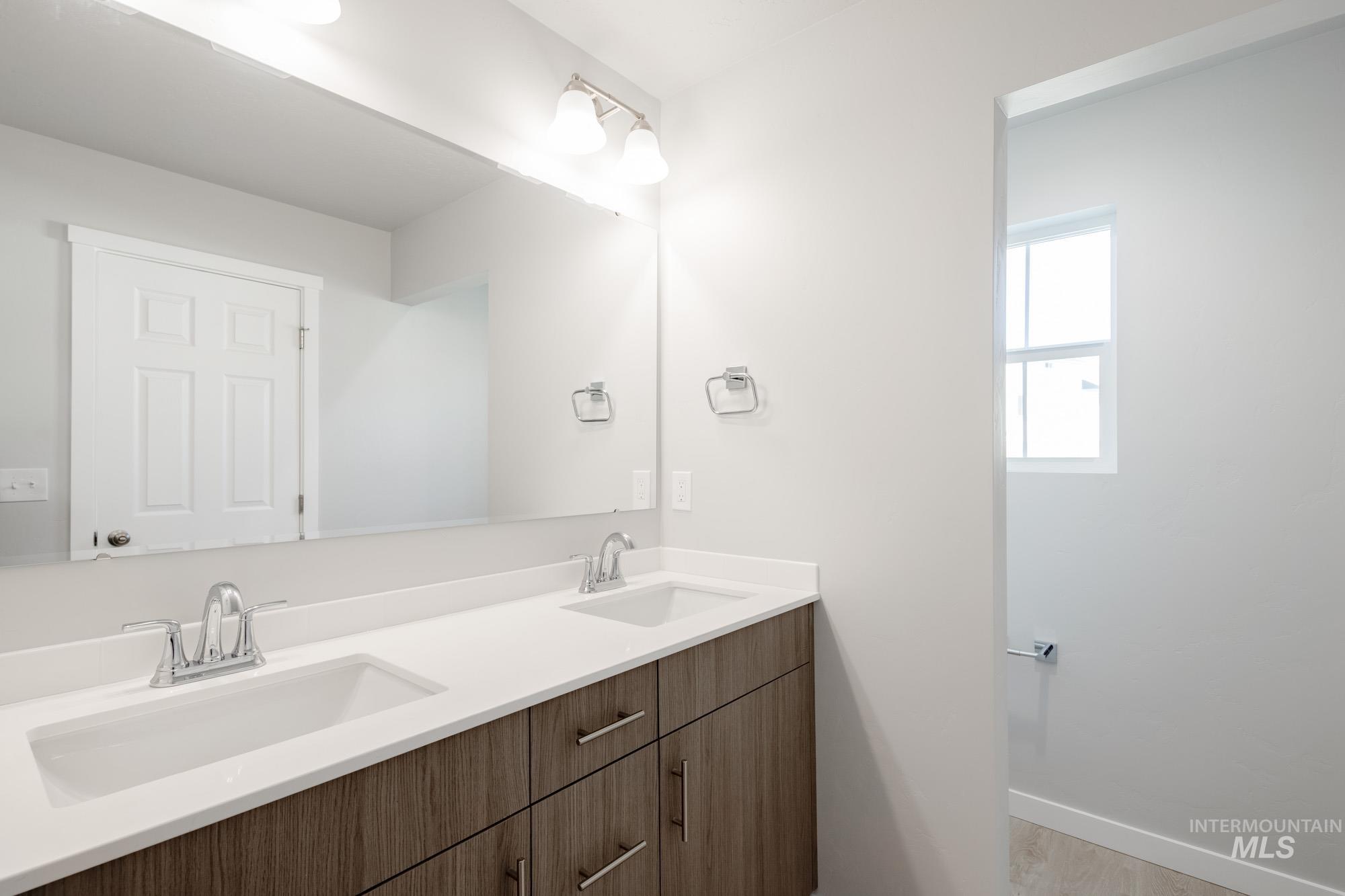 229 Moose Street Horseshoe Bend, ID 83629 - Photo 20 of 27 Bathroom featuring double vanity and light wood-style floors