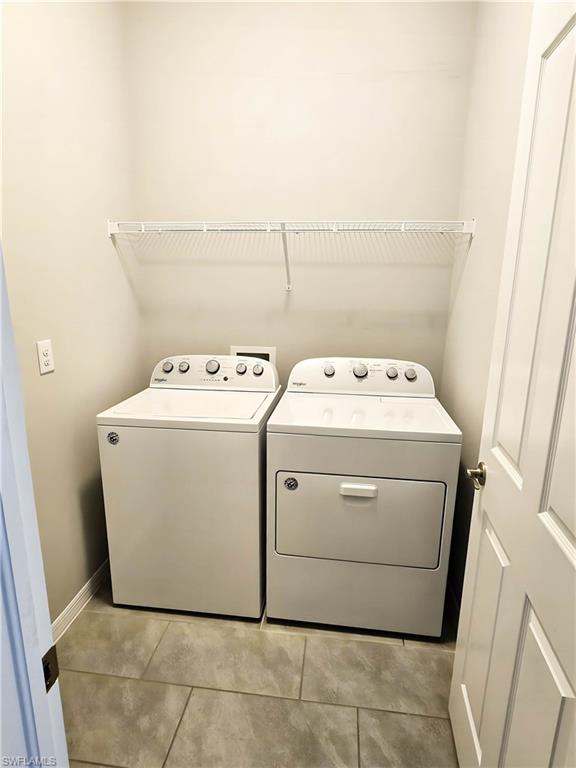 1264 Enbrook Loop Naples, FL 34114 - Photo 15 of 27 a utility room with dryer and washer