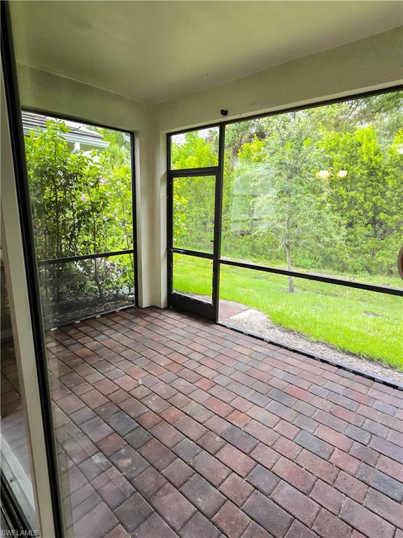 1264 Enbrook Loop Naples, FL 34114 - Photo 18 of 27 a view of empty room with windows