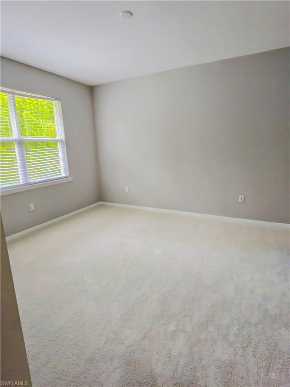 1264 Enbrook Loop Naples, FL 34114 - Photo 3 of 27 an empty room with a window