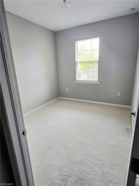 1264 Enbrook Loop Naples, FL 34114 - Photo 4 of 27 an empty room with a window