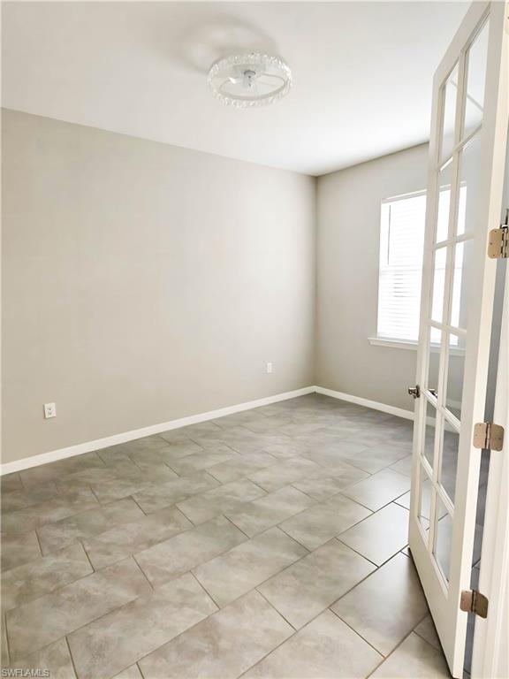 1264 Enbrook Loop Naples, FL 34114 - Photo 5 of 27 an empty room with a empty space and windows