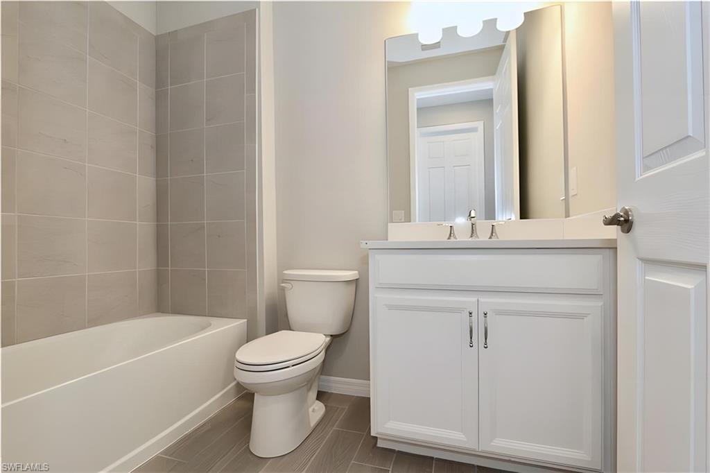 1264 Enbrook Loop Naples, FL 34114 - Photo 10 of 27 a bathroom with a sink toilet and shower