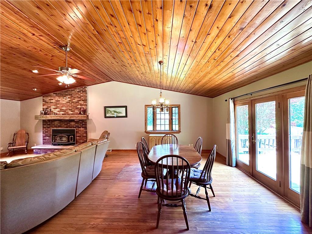 752 Covered Bridge Road Volant, PA 16156 - Photo 12 of 48 a view of a dining room with furniture window and wooden floor